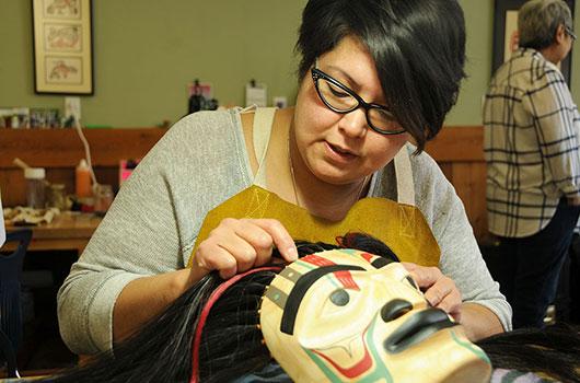 female student making a mask